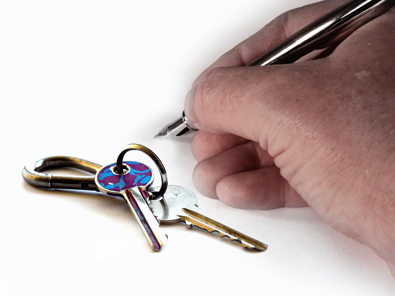 a person holding a pair of scissors