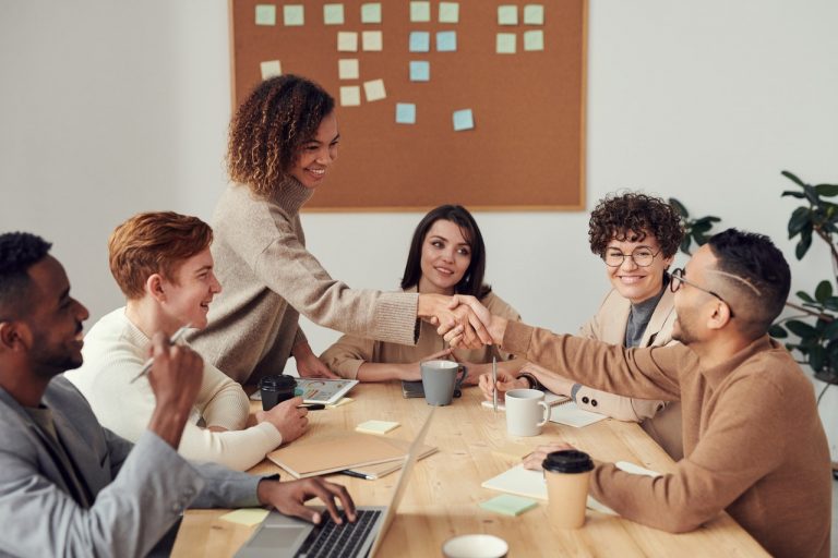 a group of people sitting around a table