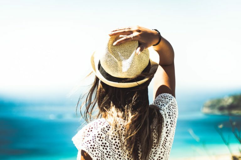 a person wearing a hat and sunglasses