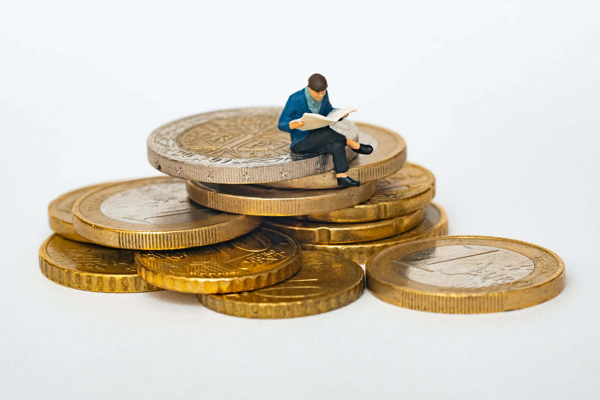 a person sitting on a pile of coins