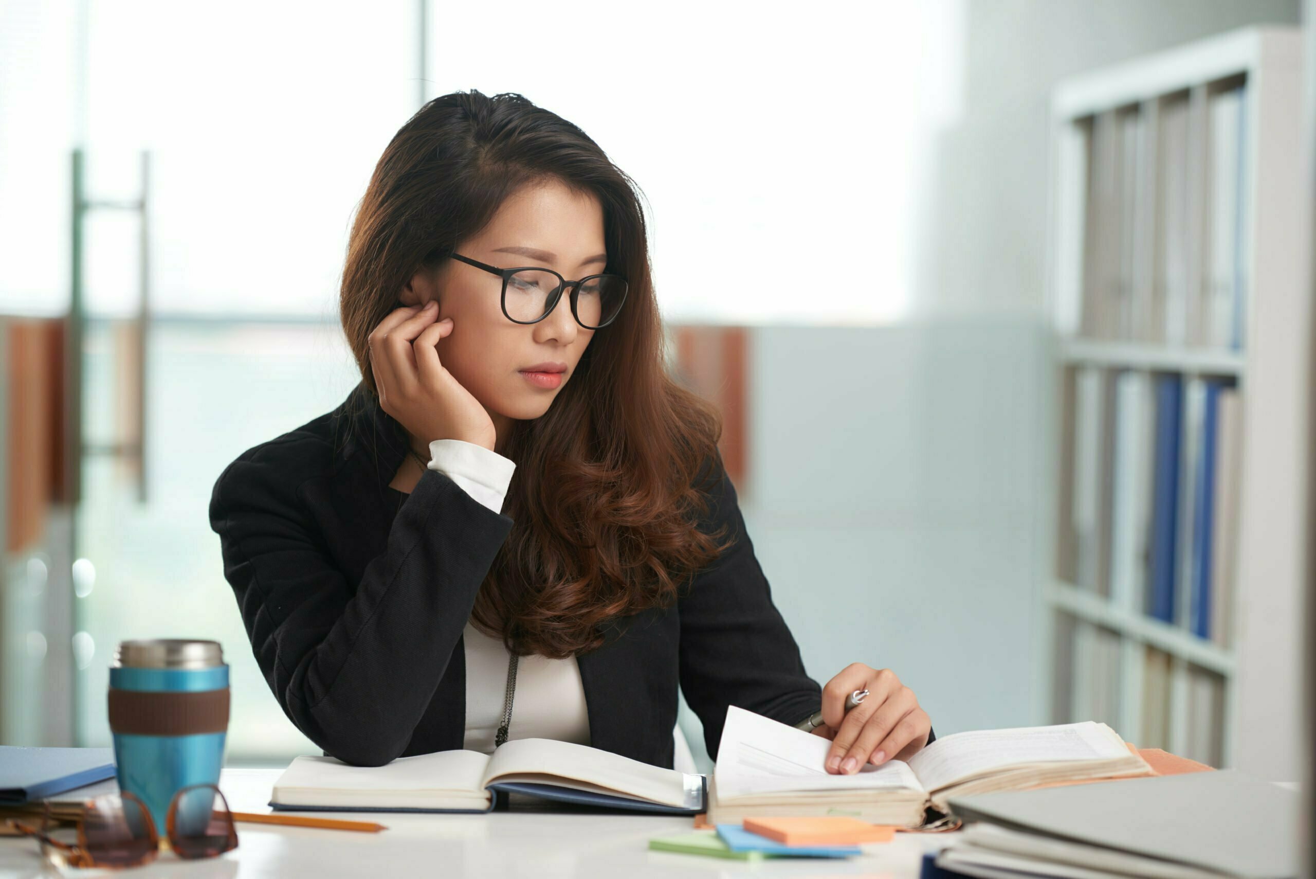 a woman sitting at a desk