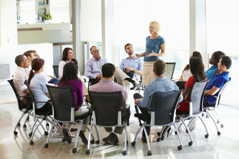 a group of people sitting in a room