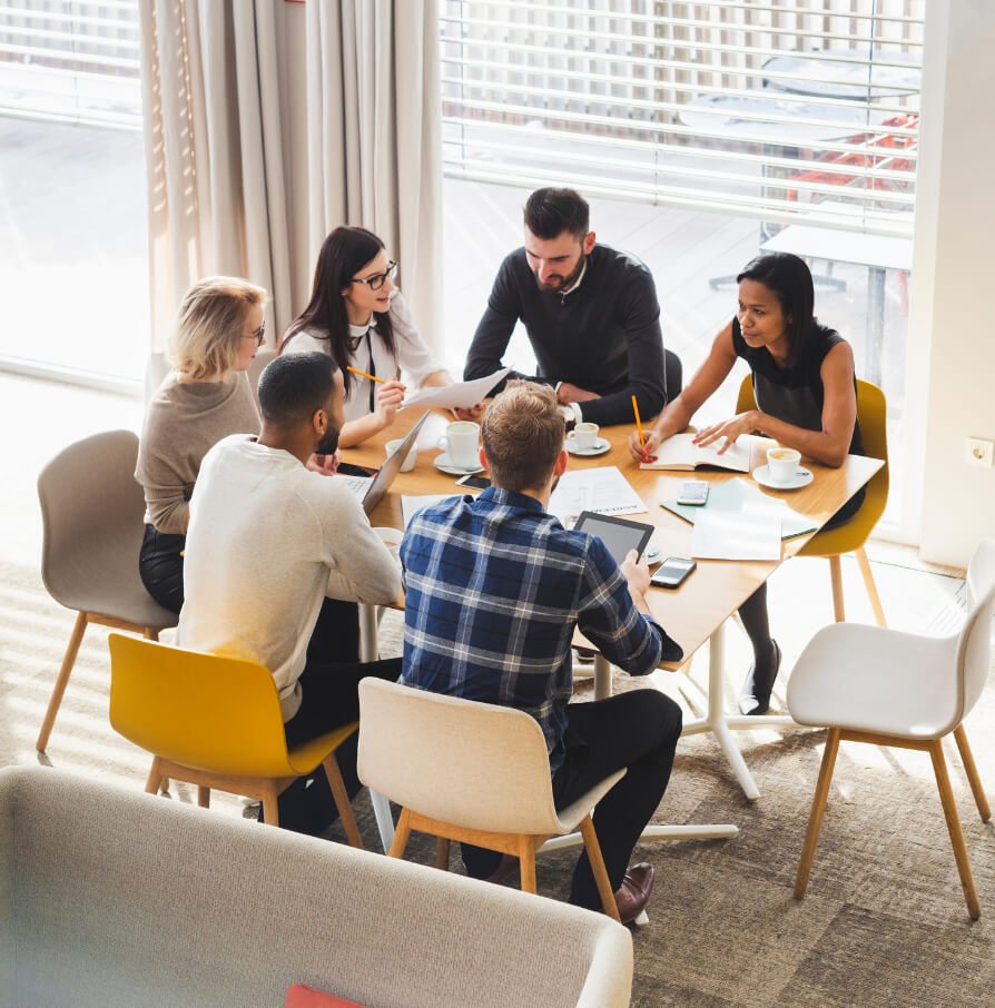 a group of people sitting around a table